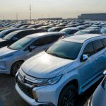 A parking lot filled with vehicles, symbolizing payment disputes and the role of debt collection for suppliers in California's automotive parts industry.