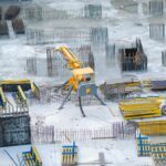 A construction site with rebar and equipment, symbolizing the challenges of managing payment disputes and the importance of debt collection in California's construction industry.