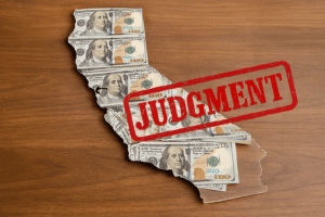 Map of California made from U.S. hundred-dollar bills on a wooden surface with a red “JUDGMENT” stamp overlay, symbolizing legal debt enforcement against international companies.